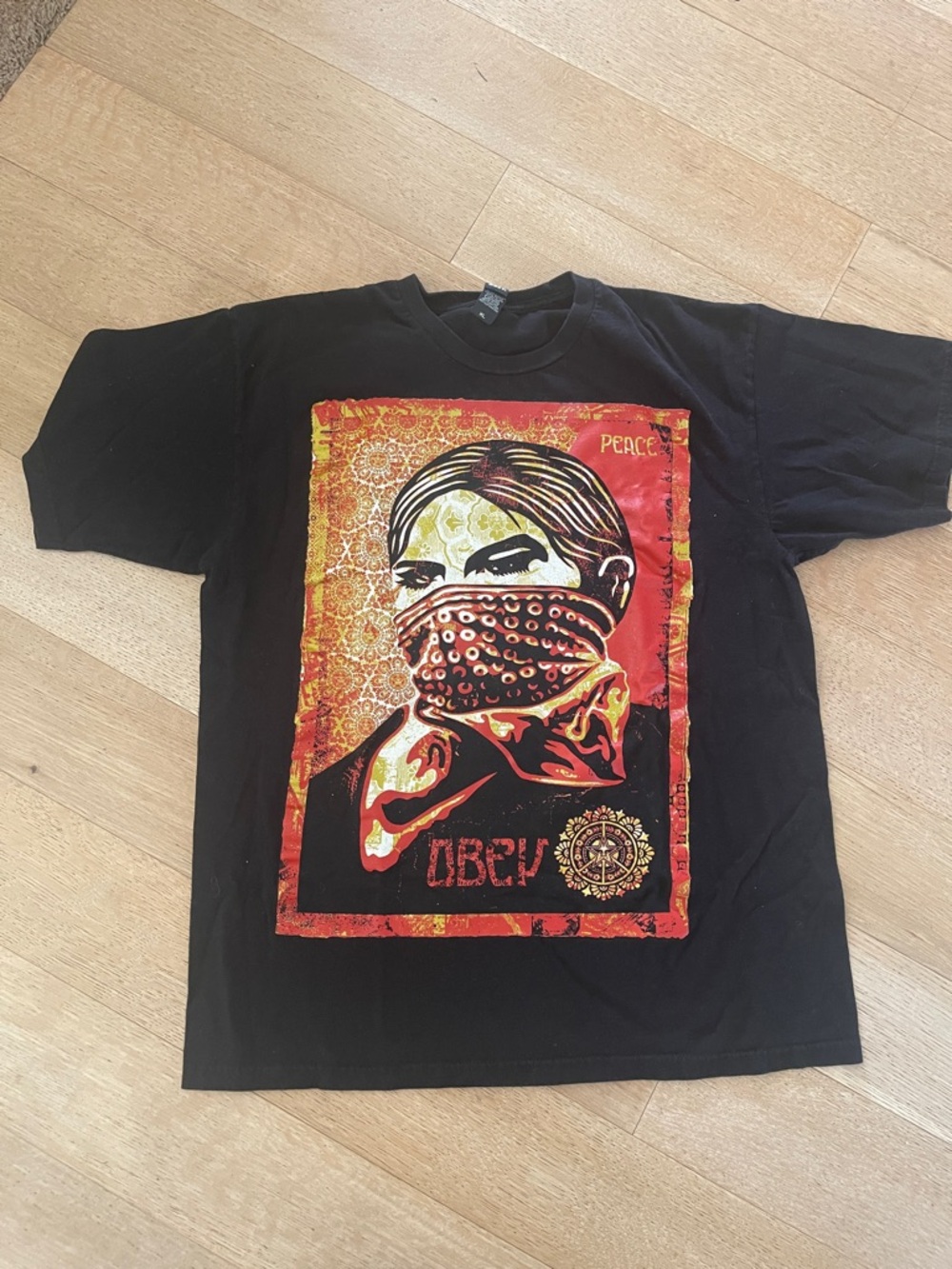 Obey Shepherd Fairy - Black Short Sleeve Tee with Red & Yellow Graphic